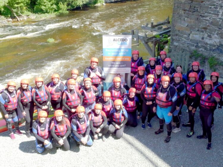 Alcedo Care team doing the White Water Rafting challenge